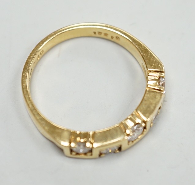 A modern 18ct gold and five stone diamond set half hoop ring, size M/N, gross weight 4.9 grams.